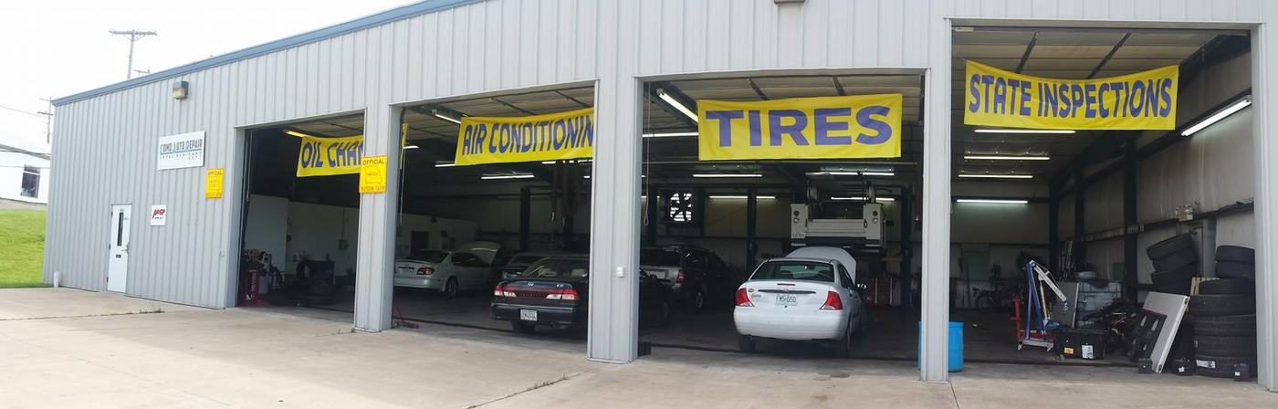 Open bay doors with the yellow service banners hung above them